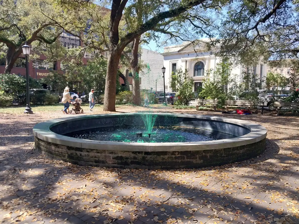 The Johnson Square fountain dyed green for St. Patrick's Day, inside Savannah's to-go cup zone